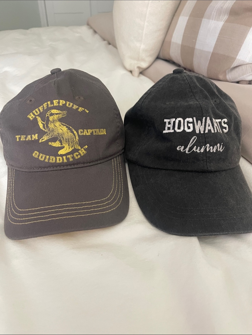 Disney Hufflepuff Quidditch Brown Cap & Disney Hogwarts Alumni Black Cap